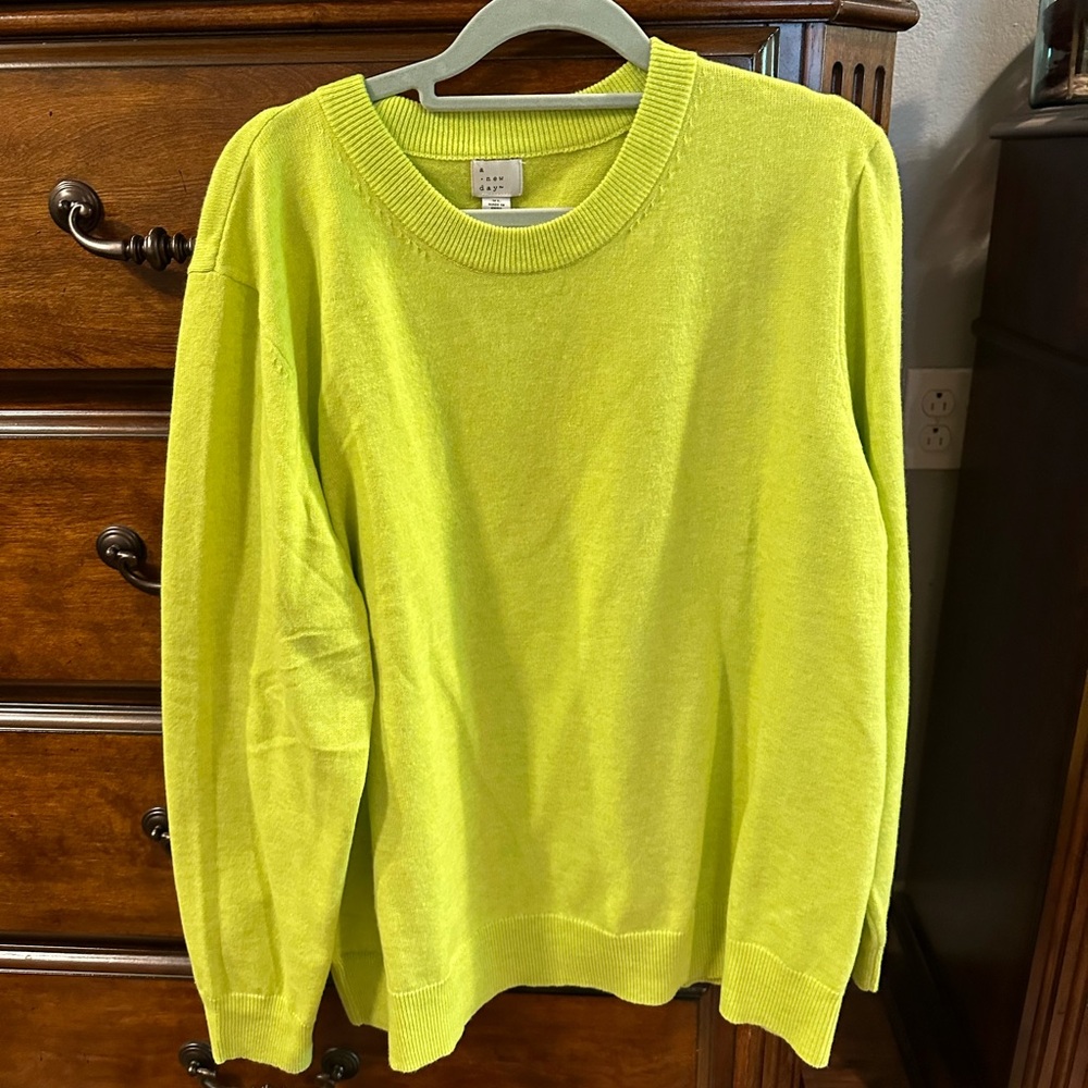 Lime green sweater.